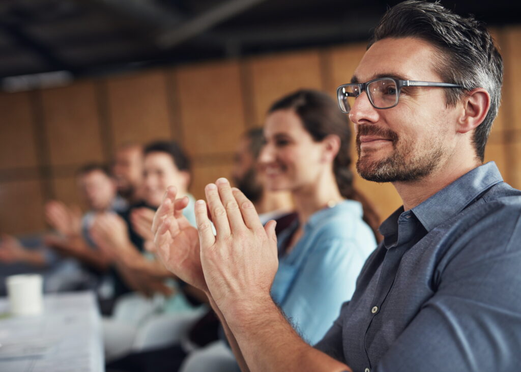 agents in meeting clapping